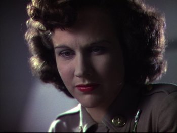 Movie still from “A Matter of Life and Death” (1946), directed by Emeric Pressburger – A person wearing a jacket; Close Up shot, Low angle