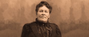 Movie still from “A Million Ways to Die in the West” (2014), directed by Seth MacFarlane – An old photograph of a woman in a black dress; Close Up shot, Low angle