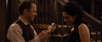 A man and a woman are holding something in their hands