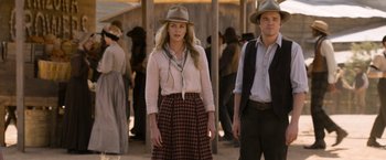 Movie still from “A Million Ways to Die in the West” (2014), directed by Seth MacFarlane – A woman and a man in a cowboy outfit; Medium shot, Over the shoulder angle