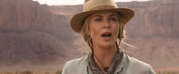 Movie still from “A Million Ways to Die in the West” (2014), directed by Seth MacFarlane – Charlize theron in a scene from the movie a million ways to die in the west; Close Up shot, Over the shoulder angle