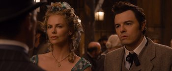 Movie still from “A Million Ways to Die in the West” (2014), directed by Seth MacFarlane – A man and a woman standing next to each other; Close Up shot, Over the shoulder angle