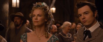 Movie still from “A Million Ways to Die in the West” (2014), directed by Seth MacFarlane – Charlize theron in a scene from the movie ' a million ways to die in the west '; Close Up shot, Over the shoulder angle