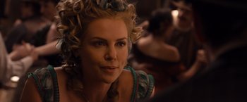 Movie still from “A Million Ways to Die in the West” (2014), directed by Seth MacFarlane – A person with curly blonde hair; Close Up shot, Over the shoulder angle