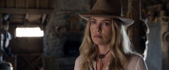 Movie still from “A Million Ways to Die in the West” (2014), directed by Seth MacFarlane – A woman wearing a cowboy hat looking at the camera; Close Up shot, Over the shoulder angle
