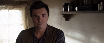 Movie still from “A Million Ways to Die in the West” (2014), directed by Seth MacFarlane – A person wearing a jacket; Close Up shot, Over the shoulder angle