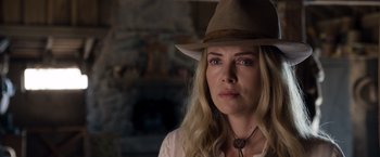 Movie still from “A Million Ways to Die in the West” (2014), directed by Seth MacFarlane – A woman wearing a cowboy hat looking at the camera; Close Up shot, Over the shoulder angle