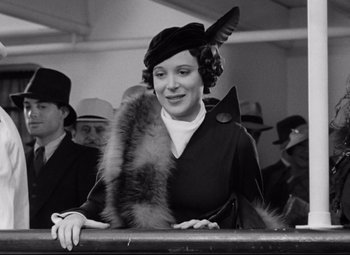 Movie still from “A Night at the Opera” (1935), directed by Sam Wood – A woman wearing a hat and a fur stole; Close Up shot, Low angle