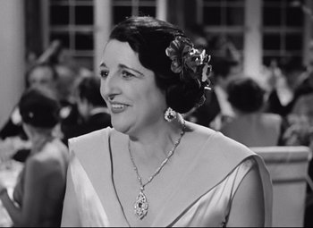 Movie still from “A Night at the Opera” (1935), directed by Sam Wood – An older woman with a flower in her hair; Close Up shot, Over the shoulder angle