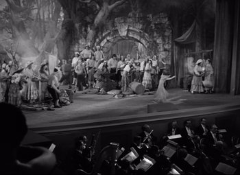 Movie still from “A Night at the Opera” (1935), directed by Sam Wood – A black and white photo of a scene from a musical; Extreme Wide shot, High angle