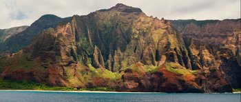 Movie still from “A Perfect Getaway” (2009), directed by David Twohy – A large body of water near a mountain range; Extreme Wide shot, High angle