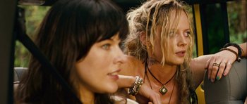 Movie still from “A Perfect Getaway” (2009), directed by David Twohy – A woman with long blonde hair sitting next to another woman; Close Up shot, Over the shoulder angle