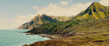 Movie still from “A Perfect Getaway” (2009), directed by David Twohy – A view of the ocean and mountains from the beach; Extreme Wide shot, High angle