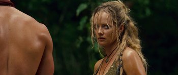 Movie still from “A Perfect Getaway” (2009), directed by David Twohy – A person with long blonde hair; Close Up shot, Over the shoulder angle