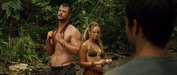 Movie still from “A Perfect Getaway” (2009), directed by David Twohy – A man and a woman standing next to each other in the woods; Medium shot, Over the shoulder angle