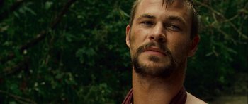 Movie still from “A Perfect Getaway” (2009), directed by David Twohy – A person with a beard; Close Up shot, Over the shoulder angle