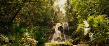 Movie still from “A Perfect Getaway” (2009), directed by David Twohy – A waterfall in the middle of a forest; Extreme Wide shot, High angle
