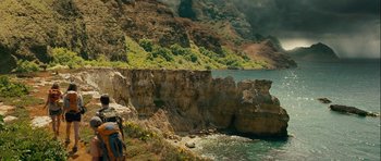 Movie still from “A Perfect Getaway” (2009), directed by David Twohy – Two people are walking along a rocky cliff side; Extreme Wide shot, High angle