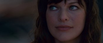 Movie still from “A Perfect Getaway” (2009), directed by David Twohy – A woman's face with blue eyes; Close Up shot, Over the shoulder angle