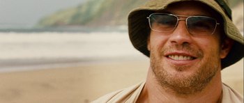Movie still from “A Perfect Getaway” (2009), directed by David Twohy – A person wearing a hat and glasses; Close Up shot, Low angle