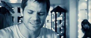 Movie still from “A Perfect Getaway” (2009), directed by David Twohy – A person with his eyes closed; Close Up shot, High angle