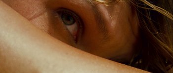 Movie still from “A Perfect Getaway” (2009), directed by David Twohy – A person's eye and a person's arm; Extreme Close Up shot, Overhead angle