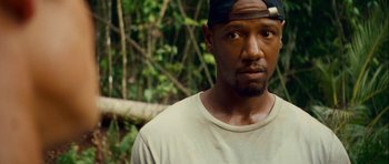 Movie still from “A Perfect Getaway” (2009), directed by David Twohy – A person wearing a hat; Close Up shot, Over the shoulder angle