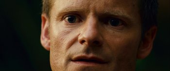 Movie still from “A Perfect Getaway” (2009), directed by David Twohy – A man's eyes and face; Extreme Close Up shot, Low angle