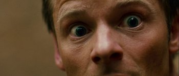 Movie still from “A Perfect Getaway” (2009), directed by David Twohy – A man's eyes looking at the camera; Extreme Close Up shot, Overhead angle