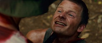 Movie still from “A Perfect Getaway” (2009), directed by David Twohy – A man with blue eyes; Close Up shot, High angle