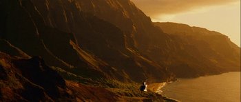 Movie still from “A Perfect Getaway” (2009), directed by David Twohy – A lighthouse on a cliff overlooking the ocean; Extreme Wide shot, High angle