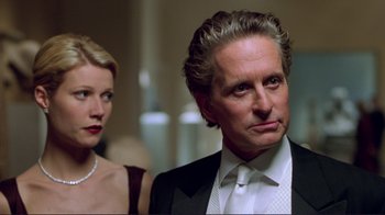 Movie still from “A Perfect Murder” (1998), directed by Andrew Davis – A man and a woman standing next to each other in a room; Close Up shot, Over the shoulder angle