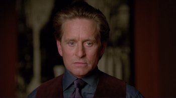 Movie still from “A Perfect Murder” (1998), directed by Andrew Davis – A person wearing a suit and tie; Close Up shot, Over the shoulder angle