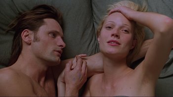Movie still from “A Perfect Murder” (1998), directed by Andrew Davis – A man and a woman laying on a bed together; Close Up shot, Overhead angle