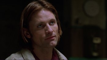 Movie still from “A Perfect Murder” (1998), directed by Andrew Davis – A person with long brown hair; Close Up shot, Over the shoulder angle