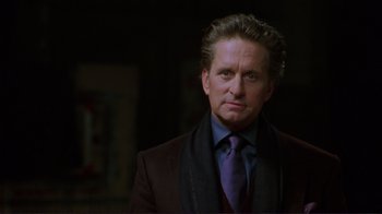 Movie still from “A Perfect Murder” (1998), directed by Andrew Davis – A person wearing a suit and tie; Close Up shot, Over the shoulder angle