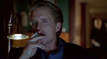 Movie still from “A Perfect Murder” (1998), directed by Andrew Davis – A person smoking a cigarette; Close Up shot, Over the shoulder angle