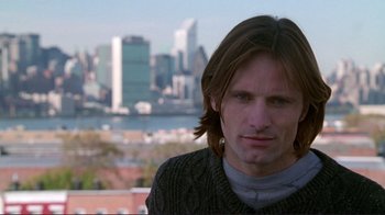 Movie still from “A Perfect Murder” (1998), directed by Andrew Davis – A person with a city in the background; Close Up shot, Over the shoulder angle
