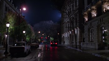 Movie still from “A Perfect Murder” (1998), directed by Andrew Davis – A city street at night lit by street lights; Extreme Wide shot, High angle