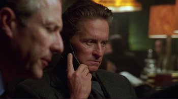 Movie still from “A Perfect Murder” (1998), directed by Andrew Davis – A man holding a cell phone up to his ear; Close Up shot, Low angle