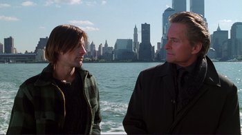 Movie still from “A Perfect Murder” (1998), directed by Andrew Davis – Two men standing next to a body of water; Medium shot, Over the shoulder angle
