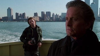 Movie still from “A Perfect Murder” (1998), directed by Andrew Davis – A man and a woman standing next to a body of water; Medium shot, Over the shoulder angle