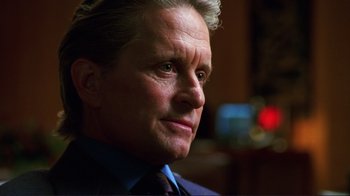 Movie still from “A Perfect Murder” (1998), directed by Andrew Davis – A person wearing a suit and tie; Close Up shot, Low angle