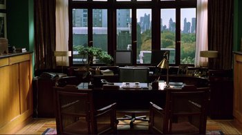 Movie still from “A Perfect Murder” (1998), directed by Andrew Davis – A living room with a large window overlooking a city; Wide shot, High angle