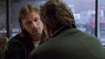 Movie still from “A Perfect Murder” (1998), directed by Andrew Davis – A man talking to another man in front of a mirror; Close Up shot, Over the shoulder angle
