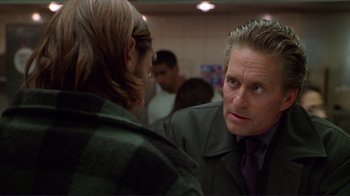 Movie still from “A Perfect Murder” (1998), directed by Andrew Davis – A man talking to another man in a room; Close Up shot, Over the shoulder angle