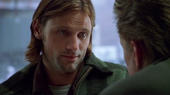 Movie still from “A Perfect Murder” (1998), directed by Andrew Davis – A person wearing a green jacket; Close Up shot, Over the shoulder angle