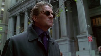 Movie still from “A Perfect Murder” (1998), directed by Andrew Davis – A person wearing sunglasses and a jacket; Close Up shot, Low angle