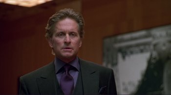Movie still from “A Perfect Murder” (1998), directed by Andrew Davis – A person wearing a suit and tie; Close Up shot, Low angle