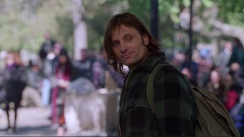 Movie still from “A Perfect Murder” (1998), directed by Andrew Davis – A man with long brown hair wearing a plaid jacket; Close Up shot, Over the shoulder angle